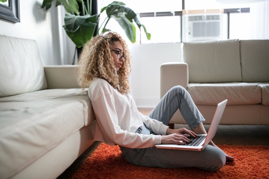 Girl on the floor Leaning on Couch 